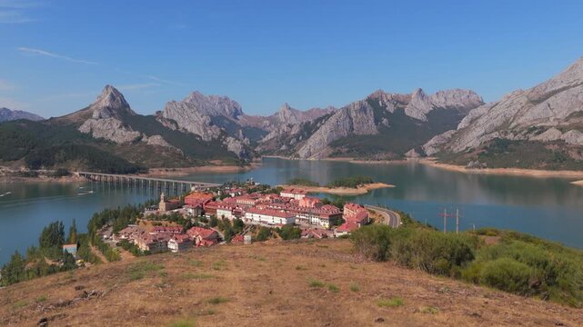 Summer rural tourism in the village of Ria&ntilde;o in Le&oacute;n, Spain. Couple admiring the scenic village of riano in spain's picos de europa mountains