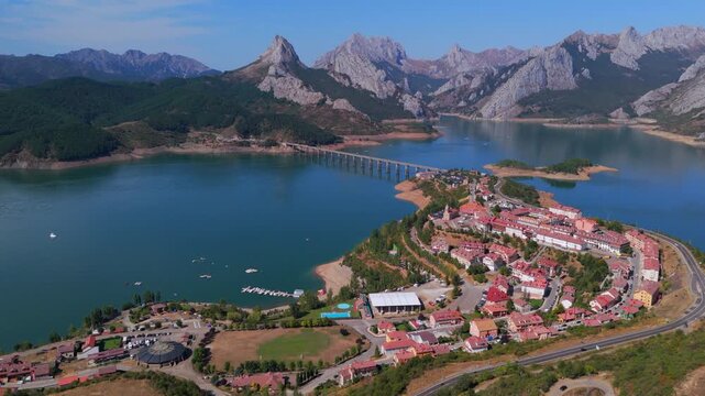 Summer rural tourism in the village of Ria&ntilde;o in Le&oacute;n, Spain. Aerial view of riano village and reservoir in picos de europa mountains