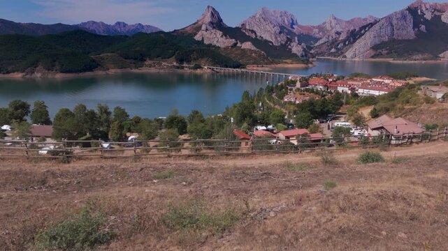 Summer rural tourism in the village of Ria&ntilde;o in Le&oacute;n, spain. Couple admiring the beautiful riano landscape in picos de europa