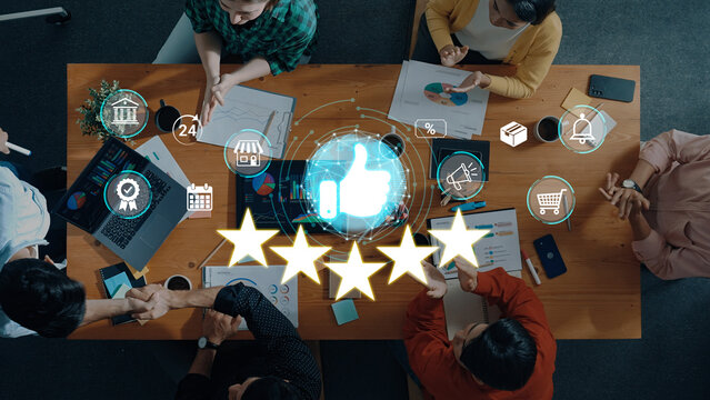 Group of diverse people collaborating around a table while analyzing data and discussing project outcomes for business success and customer satisfaction concepts. Sentient.