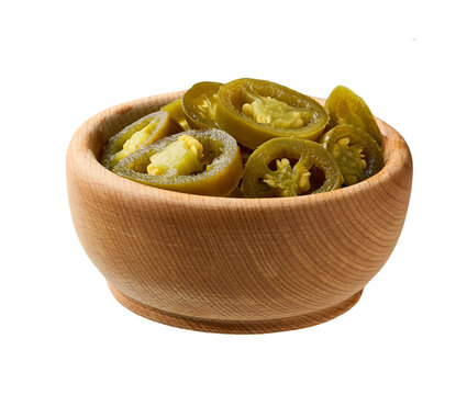pickled jalapeno in a wooden bowl isolated on a white background .