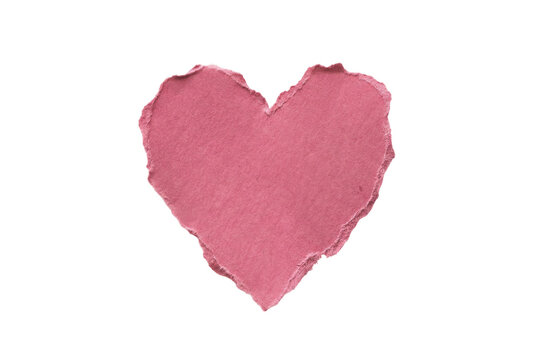 Pink ripped paper heart shape on solid black background