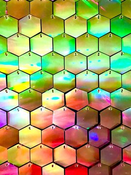 abstract colorful background with silver hexagons with night lights shining on them