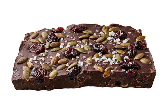 Decadent artisan chocolate fudge brownie cake square topped with roasted pecans, tart dried cranberries and coarse sea salt crystals. Creative graphic asset isolated on white background template.