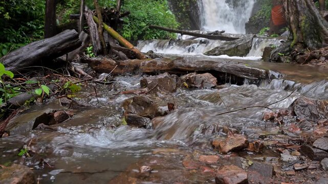 Huai Nam Yen Waterfall cascading through lush tropical rainforest in the rainy season in Omkoi District Chiang Mai, Thailand