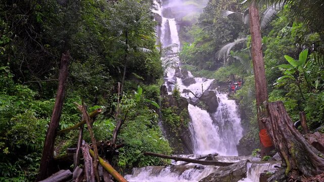 Huai Nam Yen Waterfall cascading through lush tropical rainforest in the rainy season in Omkoi District Chiang Mai, Thailand