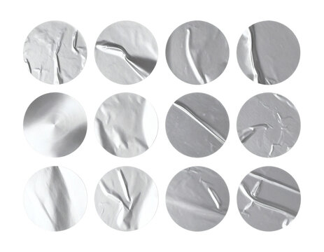 Silver sticker set featuring various wrinkled metallic circular adhesive labels with realistic creased foil textures isolated in a collection for graphic design projects&nbsp;