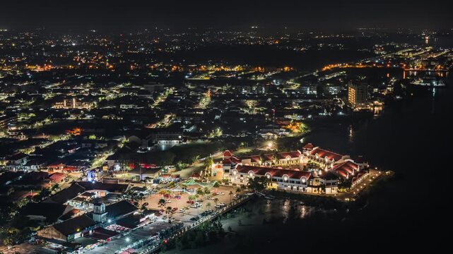 Nighttime aerial timelapse of Melaka or Malacca vibrant lights cityscape