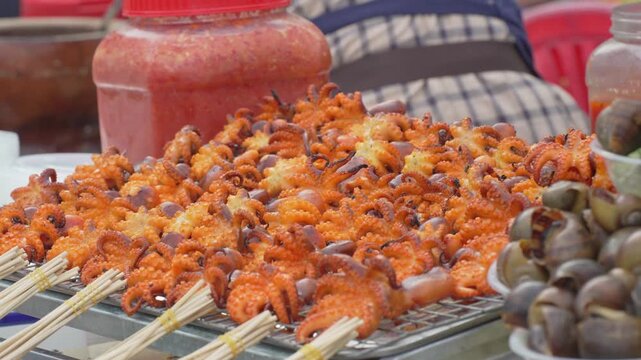 Grilled shrimp and seafood skewers at a food stall