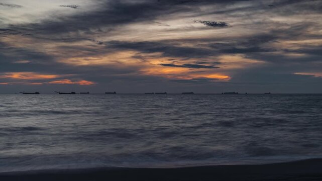 Evening to dusk sunset seascape timelapse at Pantai Puteri over the Straits of Malacca in Melaka