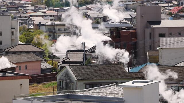 Beppu, Japan, city panorama skyline, Kannawa onsen distict, Oita prefecture, Kyushu island region, Yukemuri observation deck, rising hot steam from onsen ryokan bath houses, Beppu resort hot springs