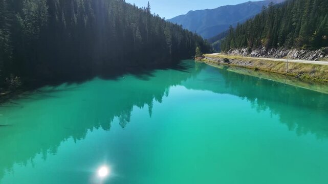 Aerial view of turquoise Olive Lake with forest and mountains in British Columbia, Canada