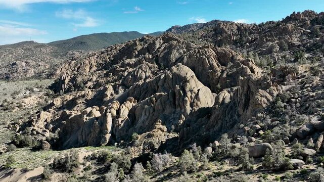 Aerial shot of interesting rock formations in the desert north of Bishop California