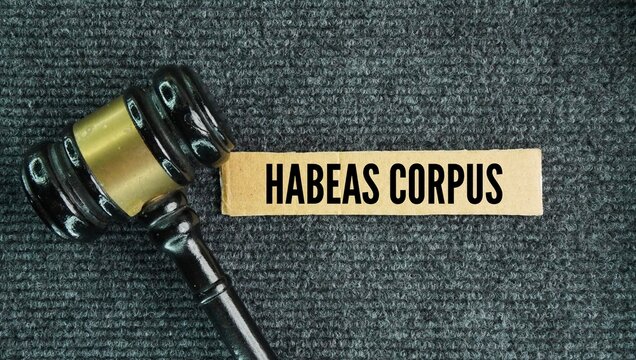 A judge's gavel and a document bearing the words "Habeas Corpus"&mdash;a court order directing authorities to bring a detainee before a judge to determine whether the detention is lawful.