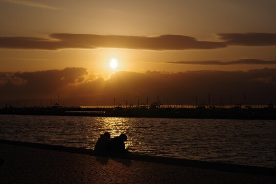 A couple lingering sunset on the  estuary