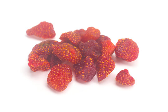 Pile of dried strawberries isolated on white