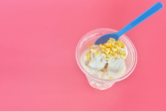 Thai coconut ice cream cup on a pink background