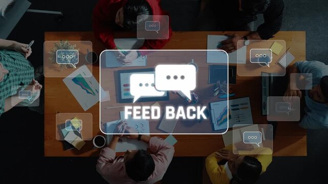 A diverse group collaborates during a meeting focused on providing constructive feedback. The creative environment promotes innovative ideas and effective strategies. Raster