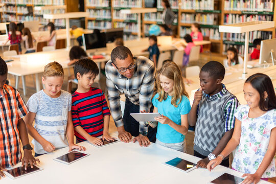 Diverse students learning technology together