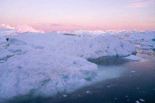 Icebergs from glacier in arctic nature landscape on Greenland.