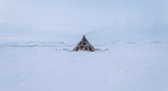 Chukchi reindeer-skin yaranga tent on snow-covered Arctic tundra