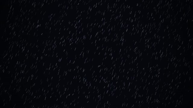 Falling Rain Drops Create Dramatic Downpour Effect Isolated Against Dark Background