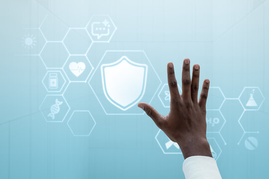 Hand reaching toward glowing shield icon on blue security interface