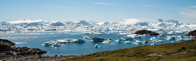 Global Warming and Climate Change - Icebergs from melting glacier in icefjord in Ilulissat, Greenland. Aerial video of arctic nature iceberg and ice landscape.  © Maridav
