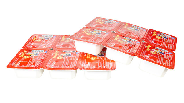 Group of Ong Tho condensed milk 40g packs arranged on white background product photography Vietnamese dairy brand packaging