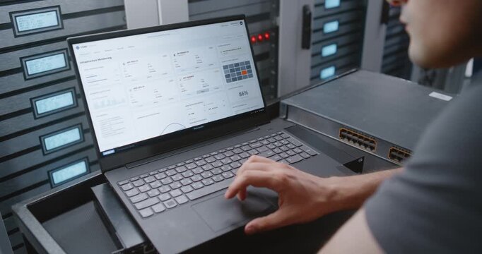 Male Network Engineer Handles Critical Overheating Event Through CLI, Reviewing Server Telemetry and Entering Recovery Commands While Monitoring Modern Data Center Infrastructure Under Pressure.
