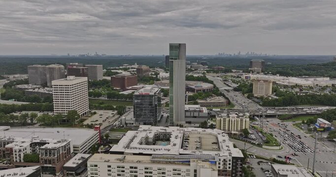Atlanta Georgia Aerial v869 drone fly toward and around company headquarter, TK Elevator building in Cumberland capturing downtown cityscape and highway traffics - Shot with Mavic 3 Cine - August 2022