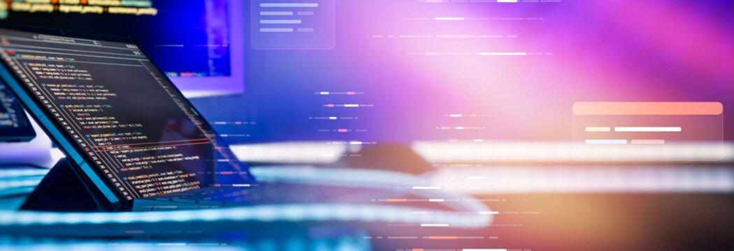 Software programming code on laptop screen with abstract glowing digital technology background and copy space