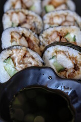 Fresh chicken teriyaki sushi rolls served with savory soy sauce at a traditional Japanese restaurant in Australia, highlighting popular food, drink, travel and tourism culinary experiences © BJP7images