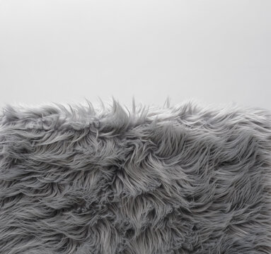 Soft grey faux fur carpet pile with copyspace background for home decor