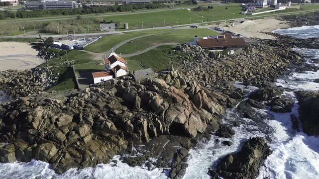 Aerial view of chapel of boa nova on rocky shore