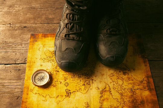 Hiking boots on a map. Travel concept.