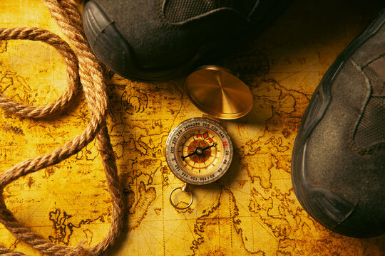 Hiking boots on a map. Travel concept.