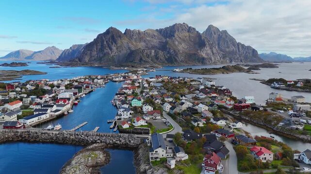 Famous football field in Henningsv&aelig;r with dramatic mountain backdrop. Lofoten Norway aerial drone. 4K.
