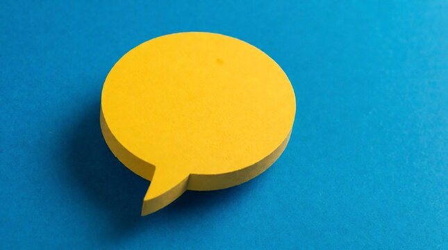 Yellow speech bubble sticky note on a vibrant blue background with copy space for communication
