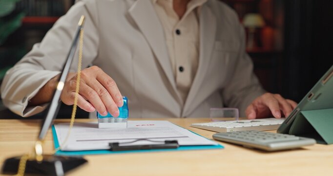 Accountant completes payment verification tasks, performing tax payment approval after final payment calculation review.