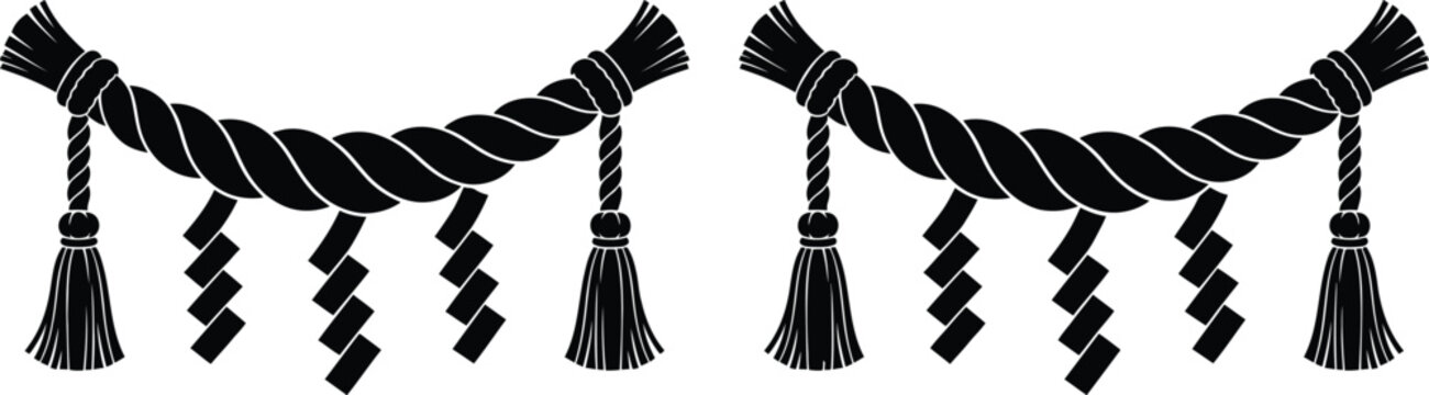 Shinto sacred rope with zig-zag paper strips and tassels for decoration.