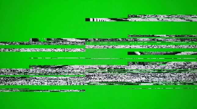 Digital television signal distortion glitching over vibrant bright green background showing severe pixelated video interference patterns