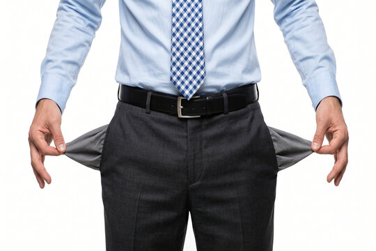 Man in business attire with empty pockets during a white studio session concept for financial hardship