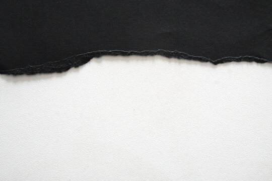 Black and white contrast of two different colored papers