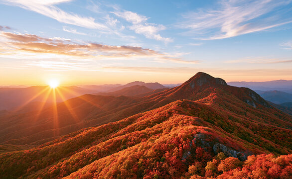 Sun rising over autumn mountain ridges, fall