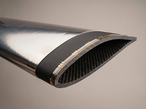 Studio cross section photograph of aircraft composite wing leading edge showcasing integrated carbon nanotube conductive film heating element for electro thermal anti icing flight safety