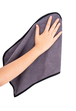 a woman's hand gesture wiping with a cloth on white background isolated