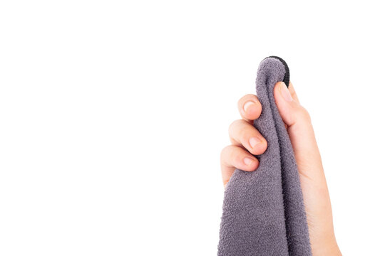 hand holding a microfiber cloth with empty space transparent for text