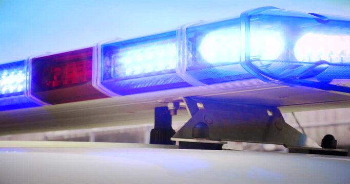 Emergency services flashing lights &ndash; police car at law enforcement crime scene, firefighter on call or light on paramedic ambulance at medical emergency. Seamless looping video.