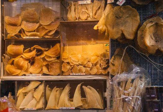 Display of dried seafood products like shark fin (sang yu chi) and fish maw or swim bladder (fa gaau) on shelves display, traditional authentic Cantonese food culture. Sheung wan, Hong Kong